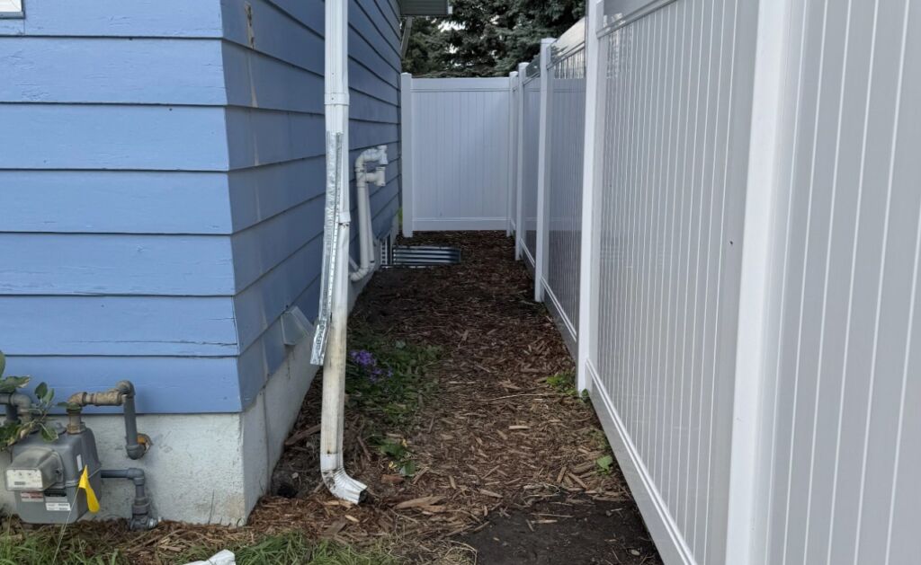 Blue house white fence 1024x629